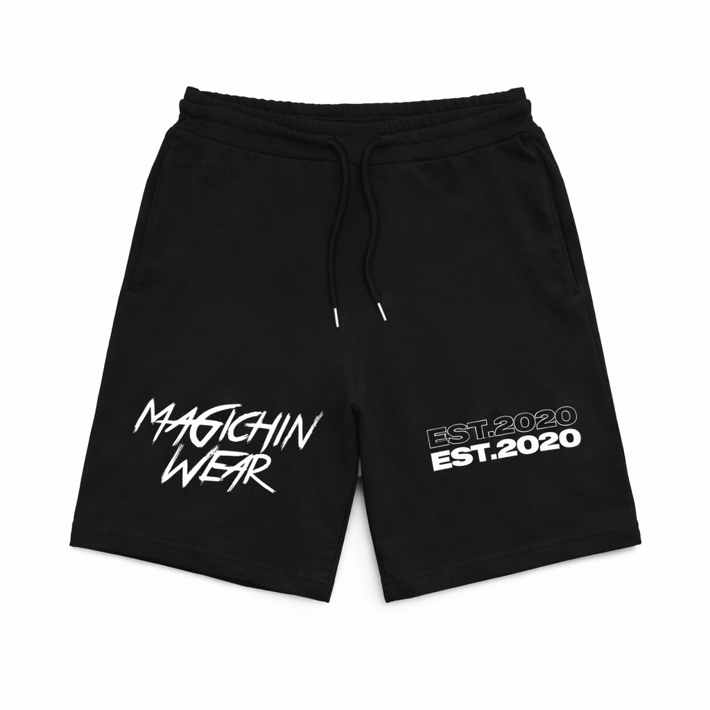 Black shorts with MAGICHIN WEAR and 'EST. 2020' text on a white background