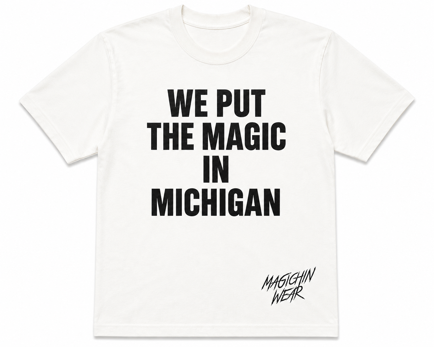 White t-shirt with black text 'WE PUT THE MAGIC IN MICHIGAN' on a white background